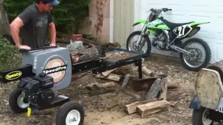 Super fast speed pro Kinetic log splitter in action - scary fast log splitting. Watch your fingers.