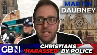 'DOUBLE STANDARDS': Police 'HARASS' Christian reading Bible as other religions PARADE UK streets