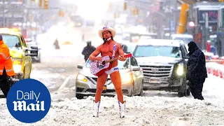 'Naked Cowboy' performs in Times Square after snow storm in New York