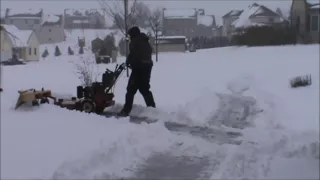 Snow plowing with a walk behind mower  walkbehind