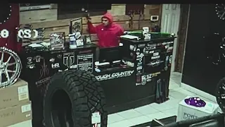 Violent robbery caught on camera at auto body shop