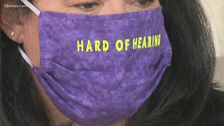 Hearing-impaired woman spreads message through mask