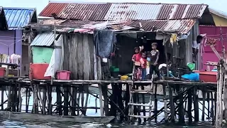 Friendly Bajau kids waved to us! Water village of Bajau tribe