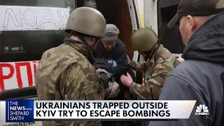 Ukrainian citizens trapped outside Kyiv try to escape attacks