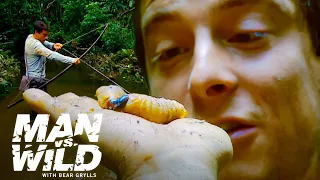 Bear Grylls Eats the Biggest Grubs He's Ever Seen | Man vs. Wild