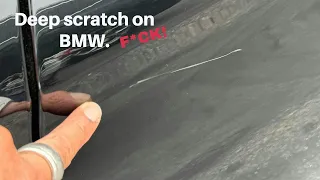 Oh no!  Black BMW is scratched.