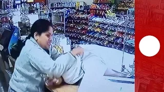 Female shopkeeper fights off gun wielding thief, Georgia