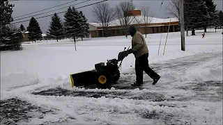 PLOWING ICE! Me scraping my driveway with snow and ice with walk behind plow with blade.
