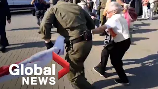 Belarus protests: Police wrestle flag from elderly demonstrator during ongoing protests