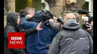 Media scuffle outside polling station - BBC News