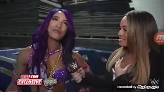 Sasha Banks holds back Tears following the wwe Evolution annoucement