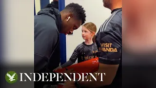 Video of Arsenal team signing young mascot's shirt divides opinions