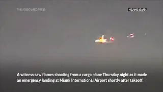 Flames seen shooting from cargo plane before emergency landing