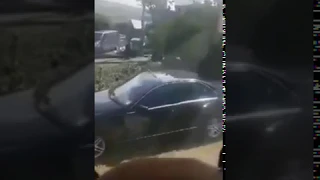 A farmer in Cornwall films the moment he sprays slurry over car parked in his field