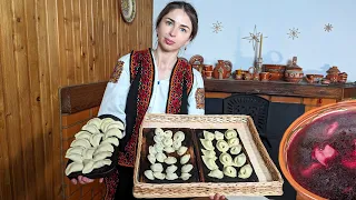 Woman is cooking WILD DRIED MUSHROOMS BORSCHT and three type of dumplings. Ukrainian food