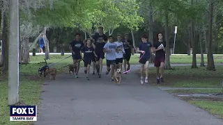 High school cross-country team takes shelter dogs out for a run