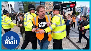 Police clash with protests at Tory party conference in Birmingham