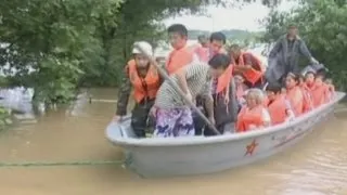 Floods in China: Hundreds rescued after being trapped in their homes