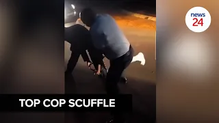 WATCH | Top cop caught on video in scuffle with a man outside estate