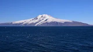 Sailing past the volcanic island of Jan Mayen HD on a cruise ship