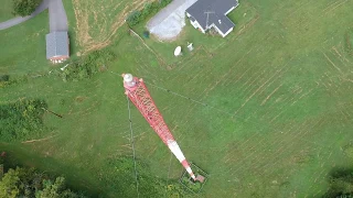 DJI Spark flies over radio tower.