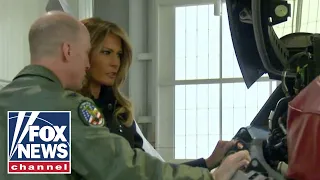 Melania Trump tours military bases, Navy aircraft carrier