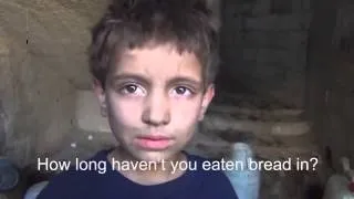 A Syrian Boy has nothing to eat but grass *MUST WATCH*.