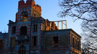 installing a roof on a burnt out chateau ruin.