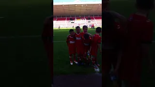 Jay dowell with his carlisle united team m8s after scoring 2 goals in a 3-3 draw against Sunderland