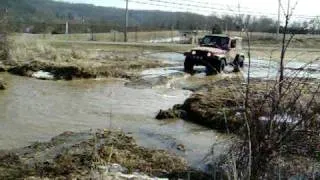 Jeep Wrangler TJ Crawling through Ditch.