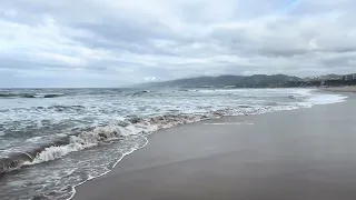 Dynamic Skies Over Calm Waves