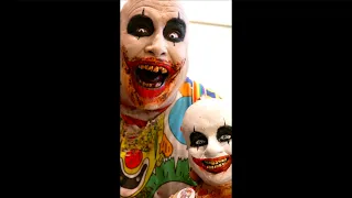 Scary Horror Clown Face with Creepy Doll