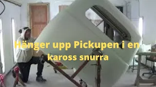 Hänger upp Pickupen i en kaross snurra