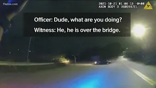 Video shows moment Atlanta officer crashes through gate to help driver who went over bridge