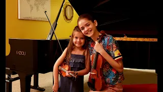 Sofia practicing violin with Anna!