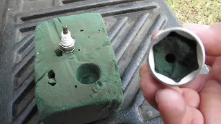 Remove spark plug from deep tube without proper spark plug socket.