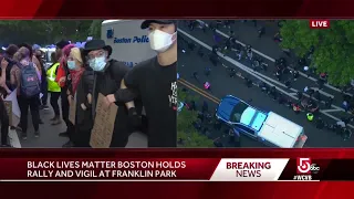 Protesters link arms to create path for Boston police caravan