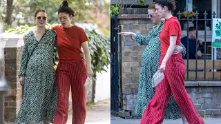 Pregnant Rose Leslie showcases her blossoming baby bump in a floral dress as she joins her sister