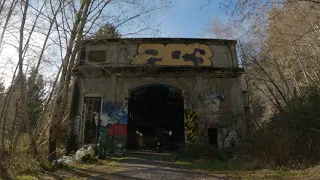 Motorcycles off roading to an abandoned building full of graffiti