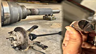 Mechanic repairs broken CV joint axle on front wheel of car  CV joint teeth machined on lathe