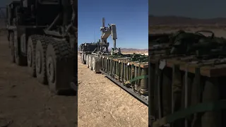Palletized Load System (PLS) loading up 155 Artillery rounds