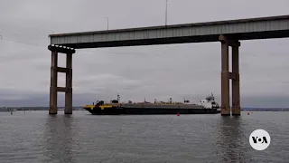 First vessel passes through temporary channel in Baltimore after bridge collapse | VOA News