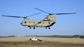 Army Soldiers Sling Load Op With CH 47 Chinook