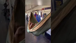 Homeless man sleeps on a hammock on NYC train, but gets interrupted by sumo wrestlers! #shorts