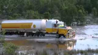 Shell Road Train Crossing a Flooded River