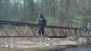 old steel bridge in woods