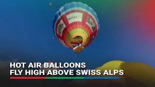 'Earth moves away' as hot air balloons fly high above Swiss Alps | ABS-CBN News