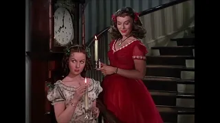 Paulette Goddard in a red dress and Susan Hayward in white floral dress - Reap the Wild Wind (1942)