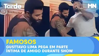 Gusttavo Lima pega em parte íntima de amigo durante show