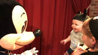 8 month old son meeting Mickey Mouse for the first time!